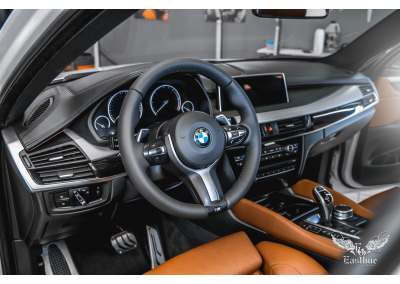 BMW X6​ -  Комплексная химчистка салона авто. Перетяжка руля в натуральную кожу.